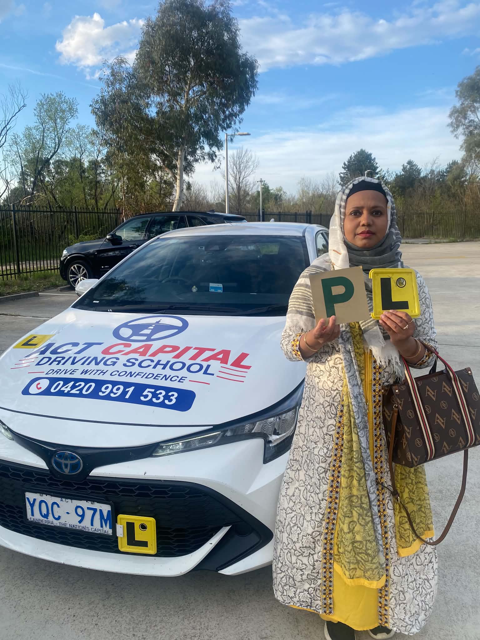 Plates in hand — driving lesson with ACT Capital Driving School in Canberra ACT